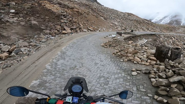 Rider in blue jacket on a motorcycle