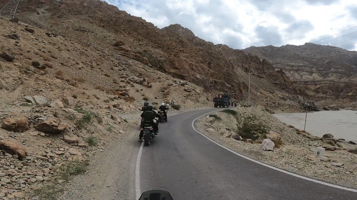 Rider in blue jacket on a motorcycle