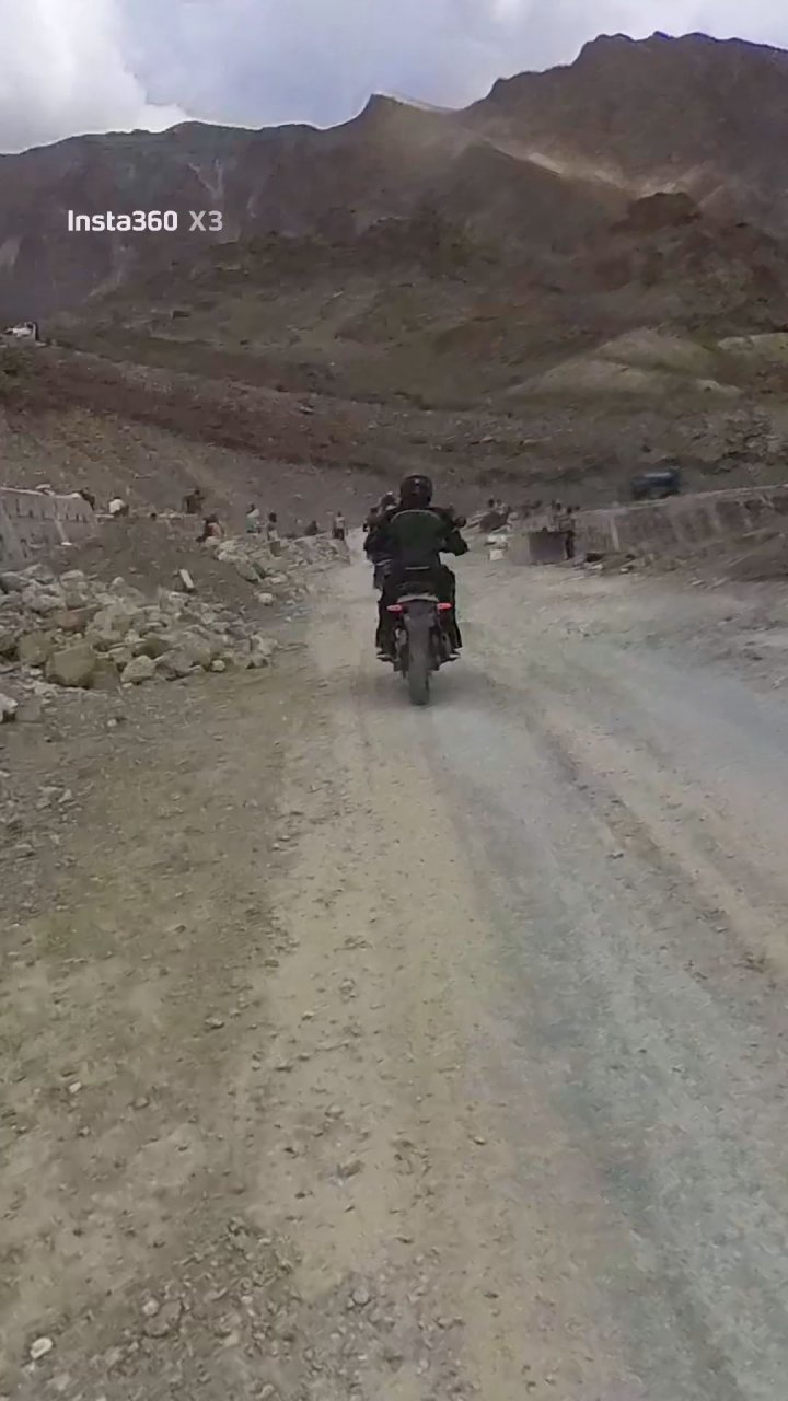 Rider in green jacket on a motorcycle