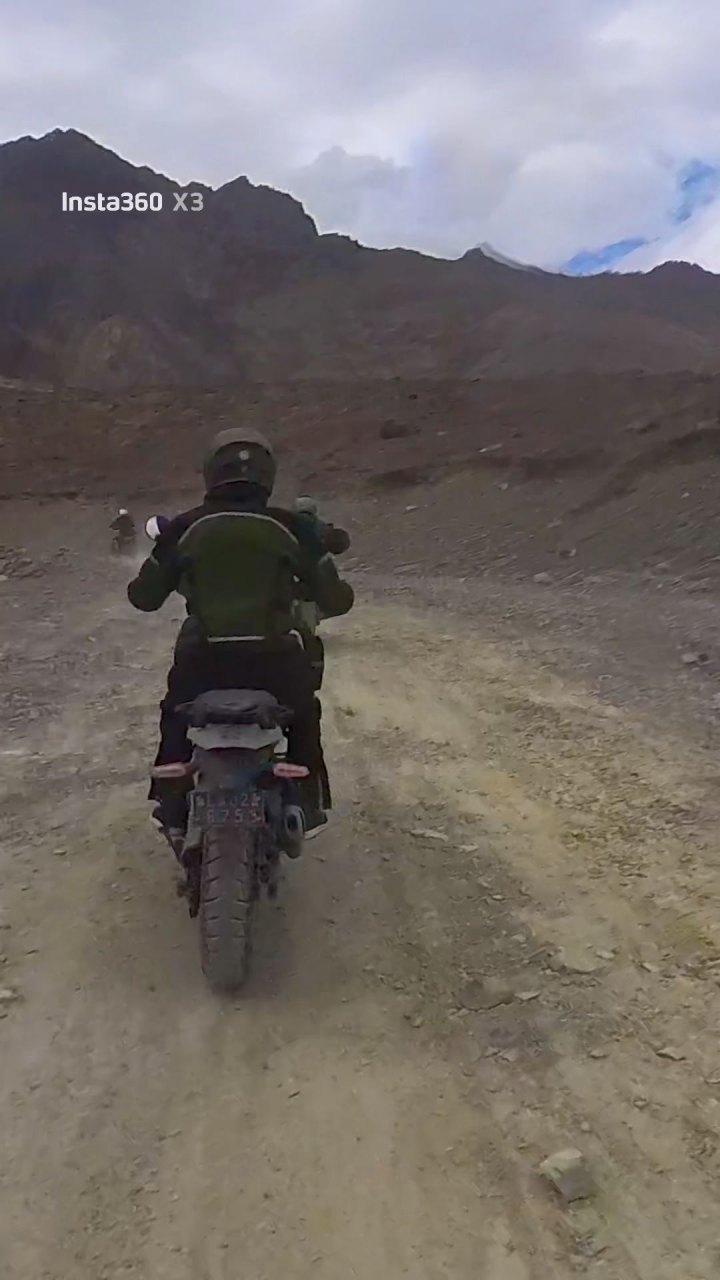 Rider in green jacket on a motorcycle