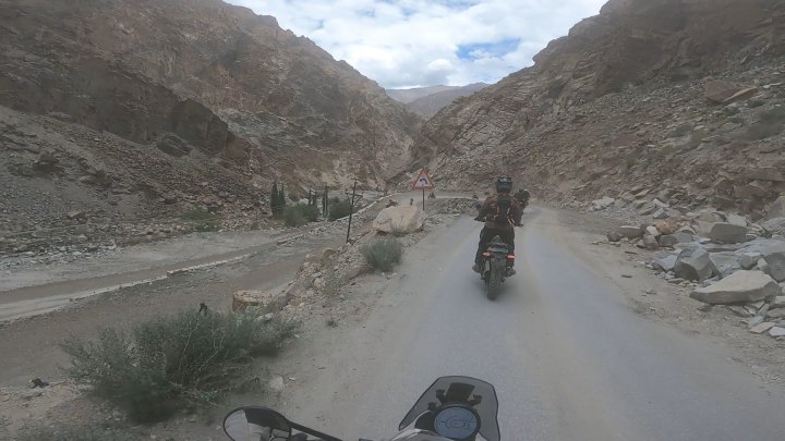 Rider in red jacket on a motorcycle