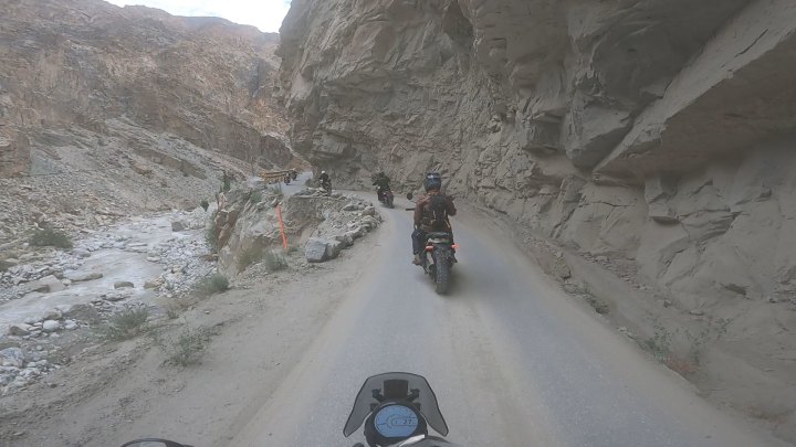 Rider in red jacket on a motorcycle