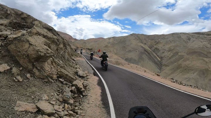 Rider in red jacket on a motorcycle