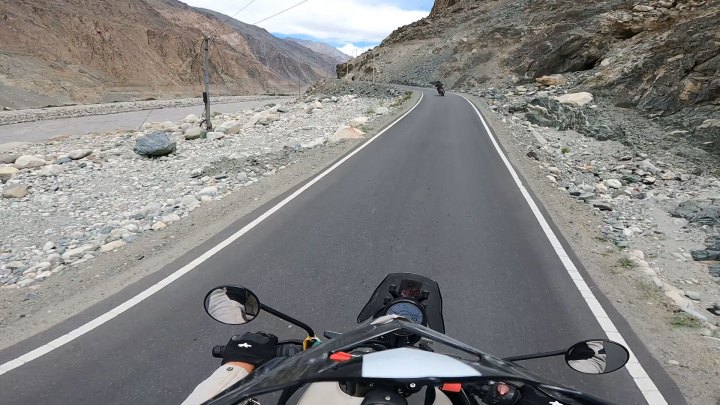 Rider in white jacket on a motorcycle