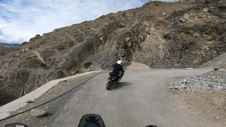 Rider in white jacket on a motorcycle