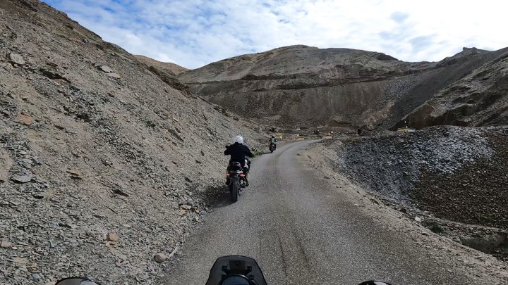 Rider in white jacket on a motorcycle